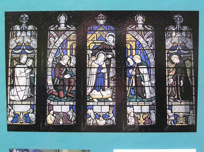 P8250126.JPG - A picture of a picture of the Lewis Carroll windows, All Saints Church, Daresbury.