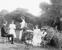 Group having tea on lawn Original caption: Group having tea on lawn