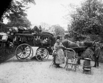 Mrs. Grey with her basket cart On Fring Lane by Sedgeford Hall garden wall Original caption: Mrs. Grey with her basket cart