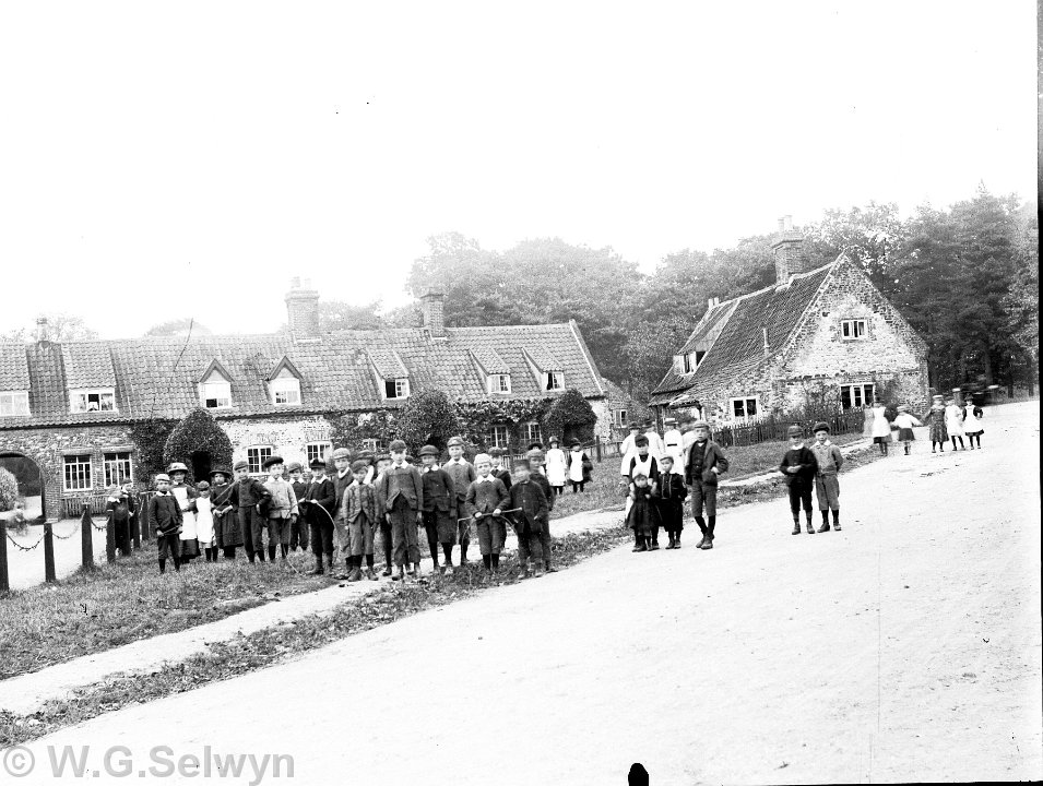 Crowd of villagers Heacham village green between Homemead and the church Original caption: Crowd of villagers