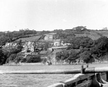 View of south Salcombe from rowing boat Sunny Cliff Hotel, Herwood, maybe Wood Grange on the skyline Original caption: View of coastline from rowing boat
