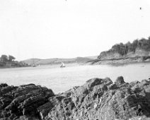 View of creek with sailing boat Original caption: Viea of creek with sailing boat