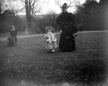 Lady with 2 small children Original caption: Lady with 2 small children