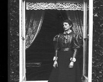 Gracie in drawing room window, Sedgeford Hall Original caption: Gracie in drawing room window