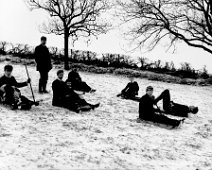 Children tobogganing Original caption: Children tobogganing