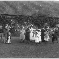 Party smoking clay pipes at Sedgeford Hall Original caption: Party blowing trumpets