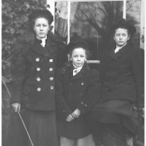 3 girls in garden Original caption: 3 girls in garden