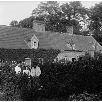 Mrs. C...'s cottages with 2 old people and herself Possibly rear of property at Dersingham. opposite Fern Hill junction (on Chapel Rd) in former ground of Dersingham Hall. Mrs C. being 'Clarkson' Original...