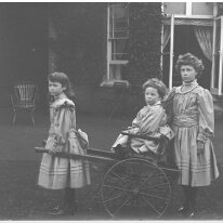 Children & mail cart Sedgeford Hall Original caption: Children and mail cart