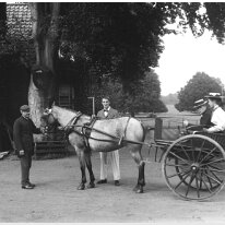 Gertie & Gerald in cart with Mr. Lucas Sedgeford Hall Original caption: Gertie and Gerald in cart with Mr. Lucas