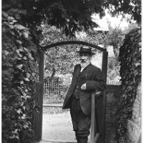 Gentleman with beard at gate Original caption: Gentleman with beard at gate