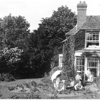 House with group not Sedgeford Original caption: House with group (not Sedgeford)
