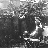 Family chatting over garden fence Comment on the back of a copy of this picture in the Woodgate box :- 15, Grimston Ave., Folkestone Auntie Emmie, Claud, Uncle Alec talking to G.O.H. N.I.H.,...