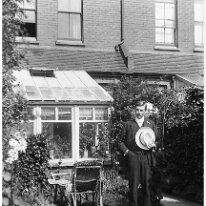 Gent with hat in a garden Original caption: Gent with hat in a garden