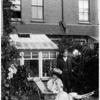 Lady and gent in garden Original caption: Lady and gent in garden
