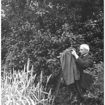 Rev. J.F. Mitchell taking children Original caption: Mr, Mitchell taking children