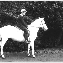 Gerald on white pony Original caption: Gerald on white pony