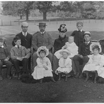 Whole Hunt family group with Ernest top left Original caption: Whole group (with Ernest top left)