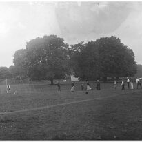 Family at cricket nets Original caption: Family at cricket nets