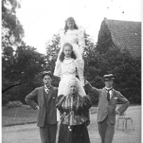 Gilbert, Reggie & Mother holding ladder with Gertie & Nona Sedgeford Hall Original caption: Gilbert, Reggie and Mother holding ladder with Gertie and Nona
