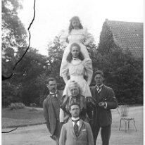 Pyramid of us all on a ladder Sedgeford Hall Original caption: Pyramid of us all on a ladder