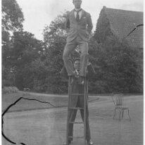 Reggie on ladder, Gilbert holding Sedgeford Hall Original caption: Reggie on ladder, Gilbert holding