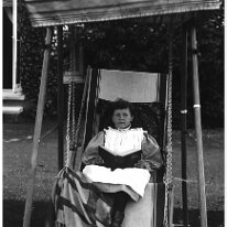 Nona in tentchair Original caption: Nona in tentchair