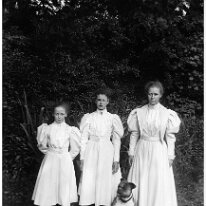 3 girls & boxer dog Original caption: 3 girls and boxer dog