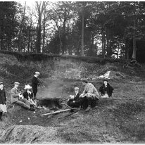 Family in the sandpits Original caption: Family in the sandpits
