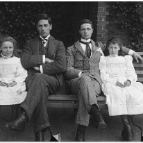 Gilbert, Reggie, Nona, & Helen (smiling) Original caption: Gilbert, Reggie, Nona, and Helen (smiling)