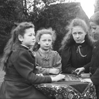Group of children playing Ludo Original caption: Group of children playing Ludo