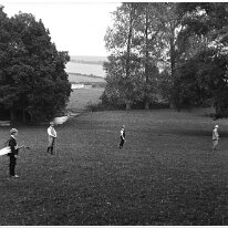 Family playing golf in park Sedgeford Hall park Original caption: Family playing golf in park