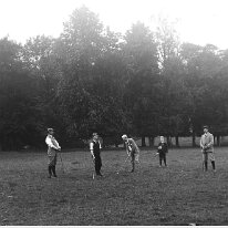 Family playing golf Sedgeford Hall park Original caption: Family playing golf