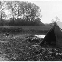 Charcoal burners tent and fire Original caption: Charcoal burners tent and fire
