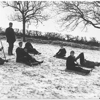 Children tobogganing Original caption: Children tobogganing