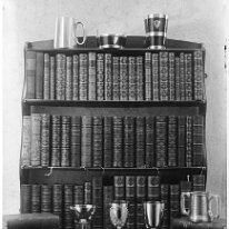Trophies on bookcase Original caption: Trophies on bookcase