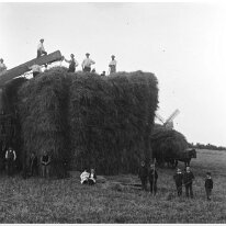 Making a rick In the field due west of Sedgeford Mill Original caption: Making a rick