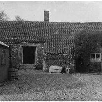 Village house and yard Original caption: Village house and yard