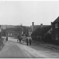 Sedgeford village street scene Looking East towards Cole Green corner and the junction of Heacham Rd. and Fring Rd., Sedgeford Original caption: Village street scene
