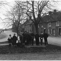 Youths on Sedgeford village green Cole Green looking west Original caption: Youths on Sedgeford village green