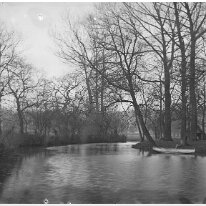 Man in boat on river Original caption: Man in boat on river