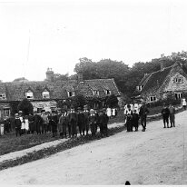 Crowd of villagers on Heacham village green Heacham village green between Homemead and the church Original caption: Crowd of villagers