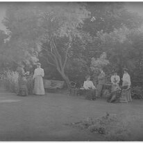 Family group in a garden Original caption: Family group in a garden