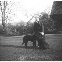 Father with 2 dogs Original caption: Father with 2 dogs