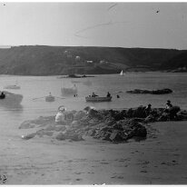 Scene of fishing boats and swimmers View to South Sands Beach probably from the southern end of Sunny Cove beach – Same promontory outline at top left of frame as seen in S5:14 Original caption:...