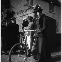 A lady with a bicycle Original caption: A lady with a bicycle