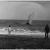 Fishing boat approaching shore Original caption: Fishing boat approaching shore