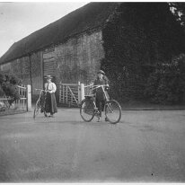 2 girls with bicycles Sedgeford Hall Original caption: 2 girls with bicycles