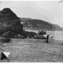 Splat Cove, Salcombe View N from Splat Cove across to North Beach's north side promontory Original caption: Boy in sailor suit on beach