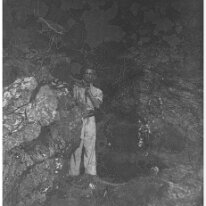 Somebody in a rock cave Original caption: Somebody in a shrubbery